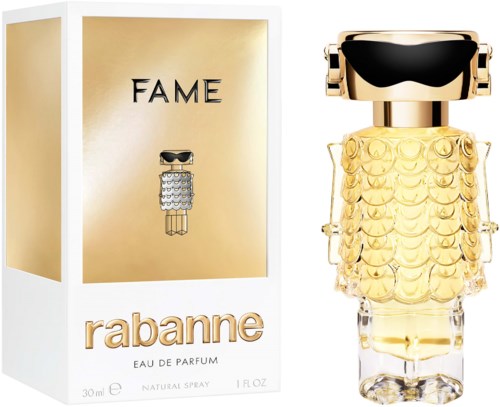 Ein Parfümflasche, die wie ein goldener Kleid geformt ist, mit schwarzen und goldenen Deckel, neben einer gold-weißen Box.