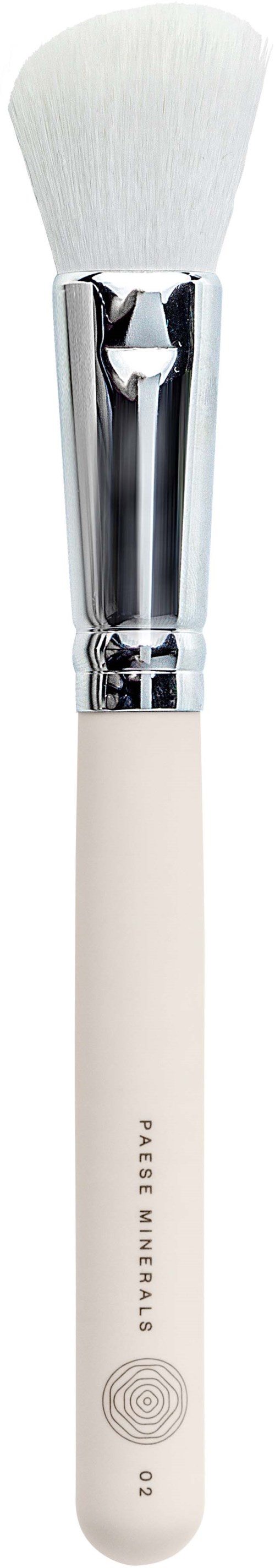 A makeup brush with white bristles and a silver handle against a black background.