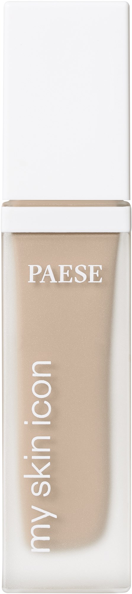 En beige foundationflaska med vit lock, märkt 'PAESE my skin icon', står upprätt.