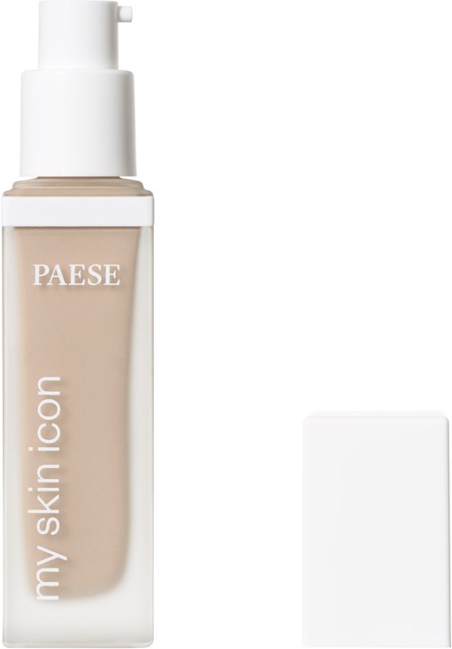 A beige liquid foundation bottle with a white pump and a separate white sponge applicator.
