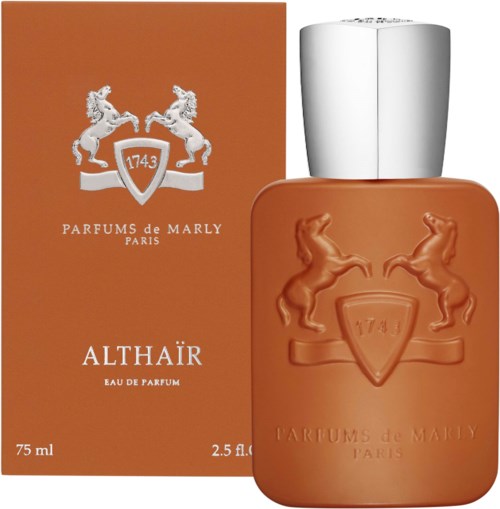 A perfume bottle in front of its orange box. The box shows two horses and a shield with the number 1743.