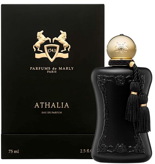 Eine schwarze Parfüfflasche mit Goldkappe und dekorativen Quasten, neben einer schwarzen Box mit goldenem Emblem und Text.