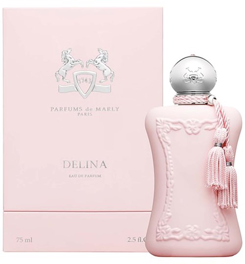 Rosa Parfümfalsche mit silbernem Verschluss und rosa Quasten, neben einer rosa Box mit Logo und Text.