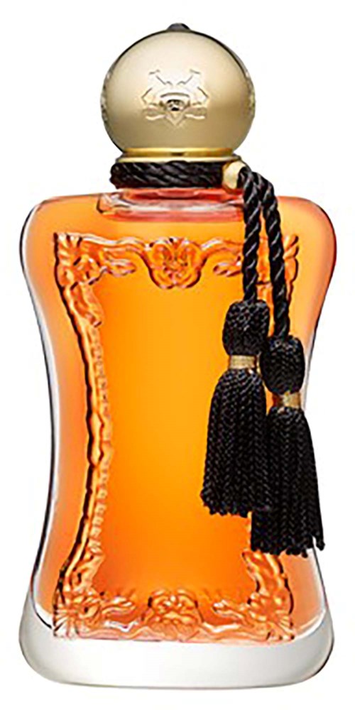 Ein Parfümflasche mit goldener Kappe, orange Flüssigkeit im Inneren und schwarze Quasten am Hals.