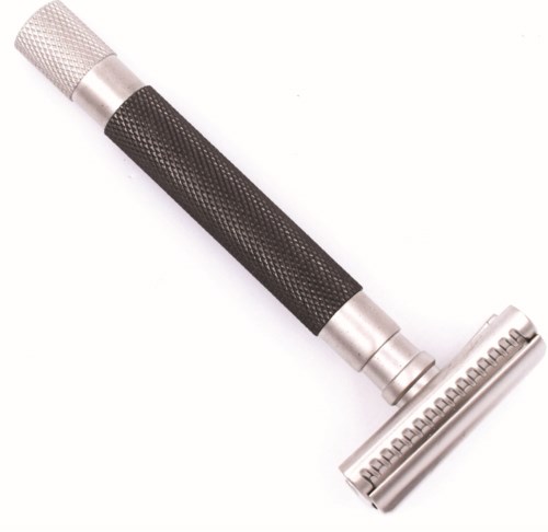 A safety razor with a textured handle and a detachable head for shaving.