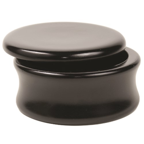 A small, round black container with a lid, smooth and shiny, looks like a cosmetic jar.