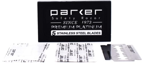 A box labeled 'Parker Safety Razor' with five stainless steel blades and information sheets in front.