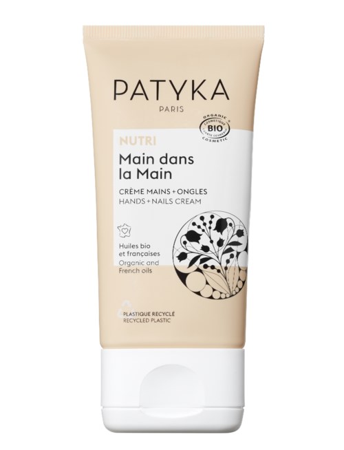 Eine Tube Patyka Handcreme mit beigem und weißem Etikett, zeigt eine schwarze Blattform und Bio-Zertifizierung.