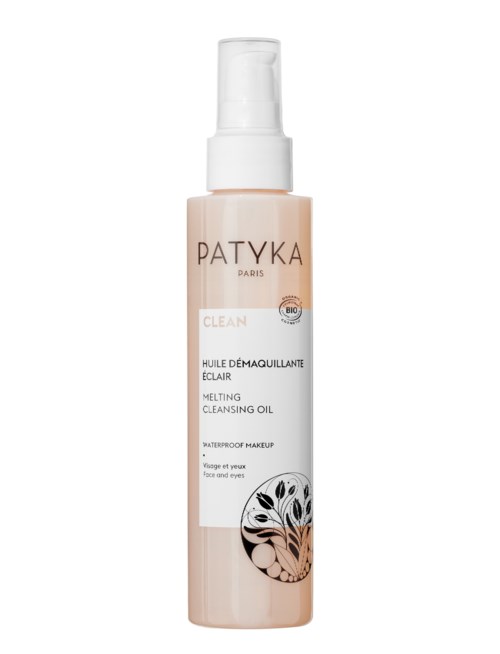 Lange, hellrosa Flasche mit schmelzender Reinigung Öl und weißem Pumpkopf, markiert Patyká Paris für Gesicht und Augen Make-up.