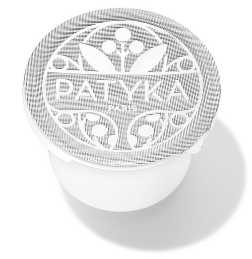 Der Deckel hat ein Blumenmuster mit dem Wort 'PATYKA' in der Mitte, und eine runde Form mit Dekorationsmustern.