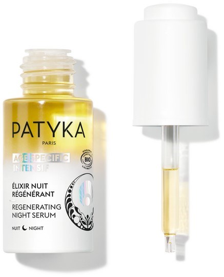 Eine Flasche Patyka regenerierendes Nachtserum mit Pipette. Das Etikett ist weiß und gelb.
