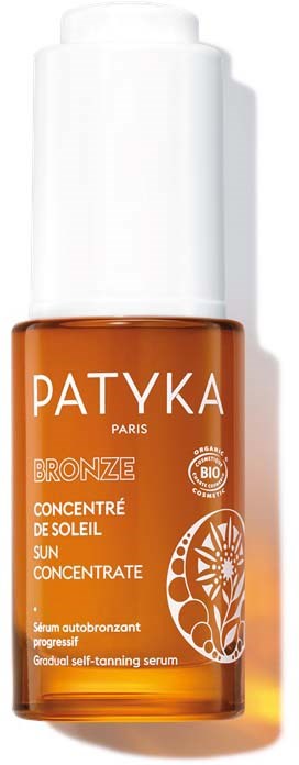 Een klein oranje flesje met een witte dop. Het heeft de merknaam "PATYKA" en het woord "BRONZE".