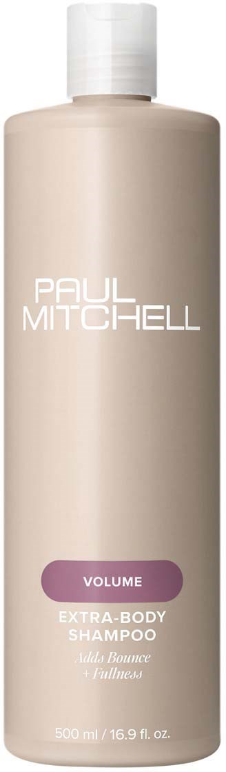 Pitkä, beige Paul Mitchell Volume Extra-Body Shampoo -pullo, jossa valkoinen korkki ja violetti etiketti.