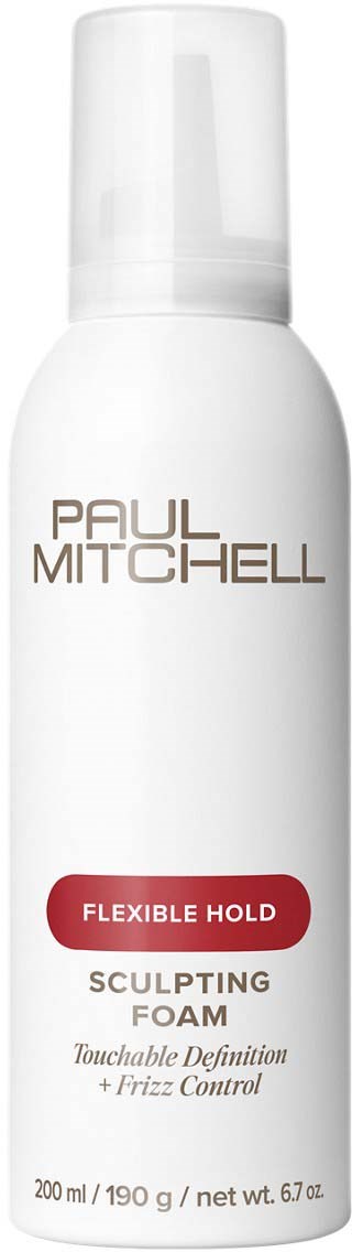 A white bottle with a spray cap labeled Paul Mitchell, promoting flexible hold sculpting foam for hair.