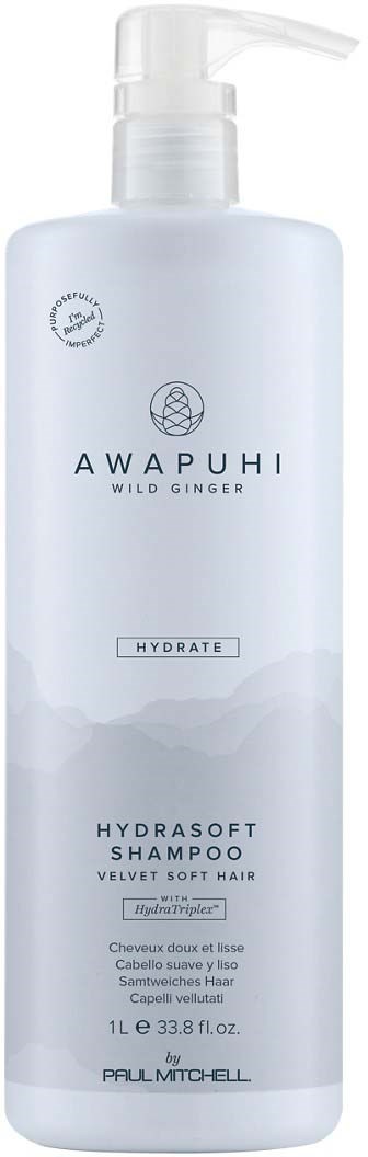 Valkoinen shampoopullo pumppina, merkitty 'AWAPUHI' ja 'HYDRATE', pehmeälle hiukselle luonnollisella inkiväärillä.