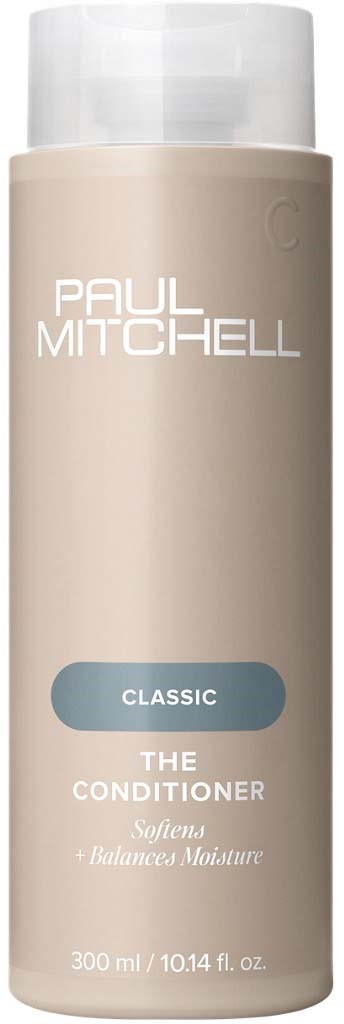 En beige flaska med Paul Mitchell-balsam med vit lock, märkt 'Classic The Conditioner' för mjuk och balanserad fukt.