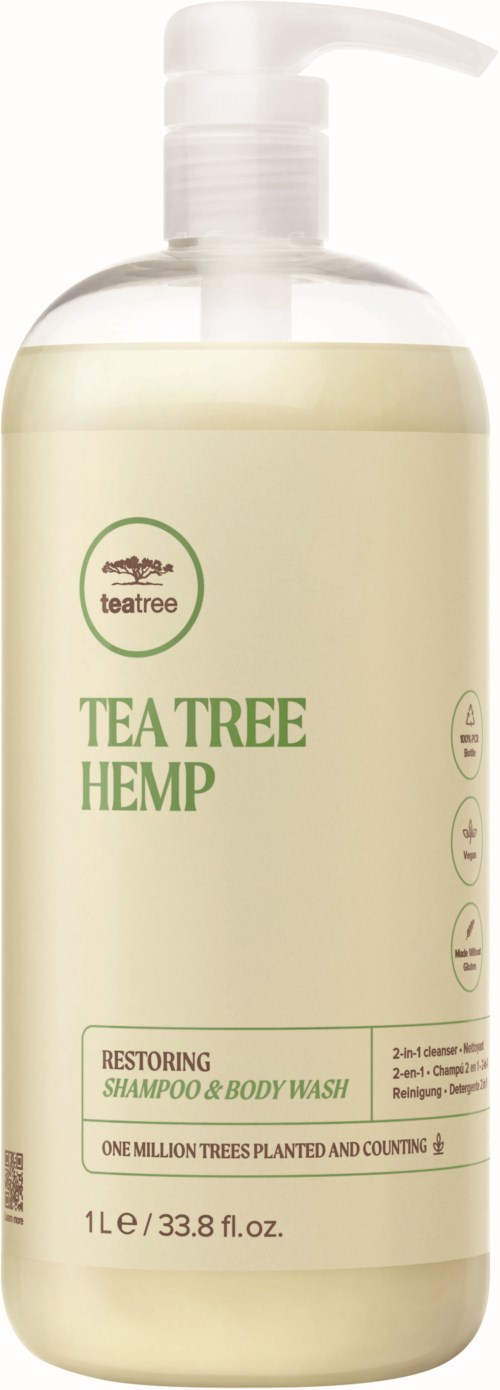 A bottle of Tea Tree Hemp Restoring Shampoo & Body Wash. It is white with green text and logo.