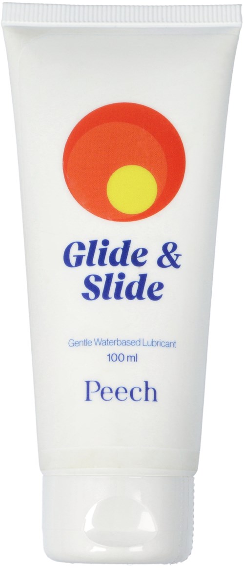 Tube mit 'Glide & Slide' beschriftet, roter und gelber Kreis, für wasserbasierte Gleitmittel, Pfirsichduft.