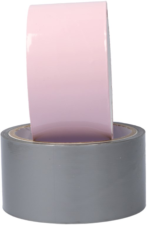 Ein rosa Klebeband steht senkrecht in einer grauen Klebebandabroller.