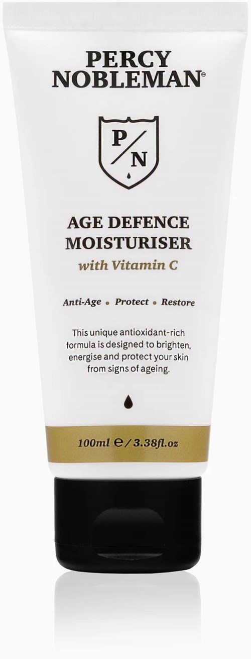 A white tube of Percy Nobleman Age Defence Moisturiser with Vitamin C, featuring black text and a gold band at the bottom.