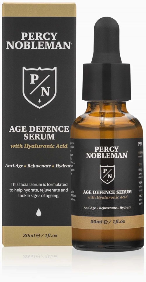 A small brown bottle with a dropper, and a black box, both labeled Percy Nobleman Age Defence Serum with hyaluronic acid.