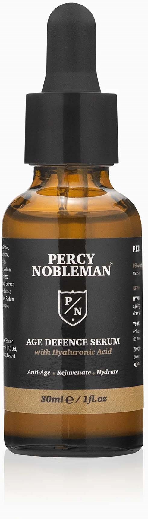 Small brown bottle with a black dropper cap, labeled Percy Nobleman Age Defence Serum with hyaluronic acid.