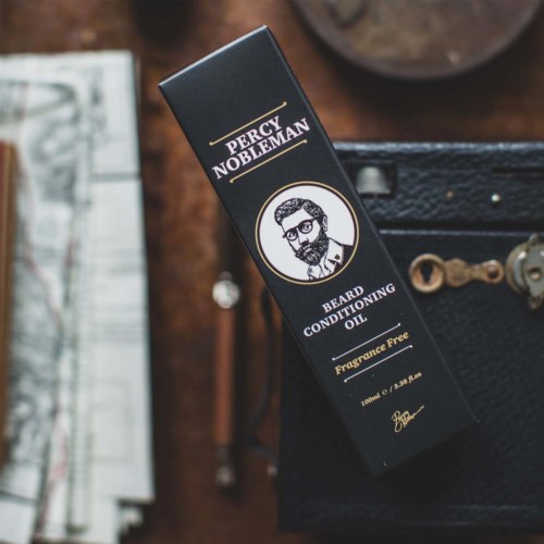 Black packaging box for Percy Nobleman beard oil, featuring a bearded man illustration and brand name.