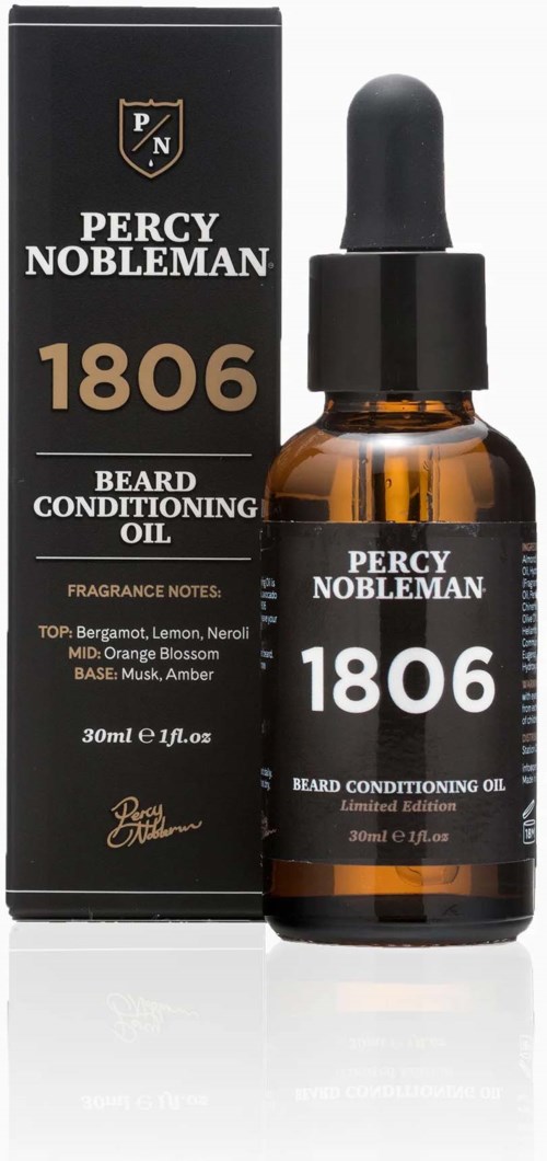A small amber bottle with a dropper, labeled Percy Nobleman beard oil, next to its box. It is a conditioning product.