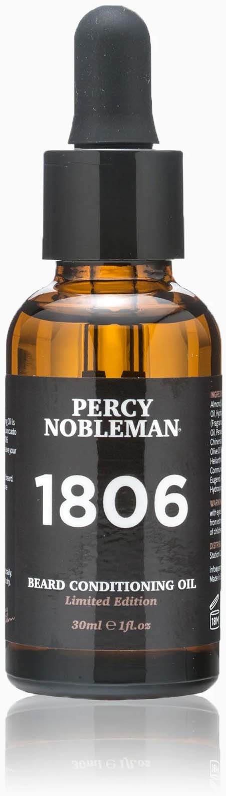 A small brown glass bottle with a black dropper cap, labeled Percy Nobleman beard oil, 30ml.