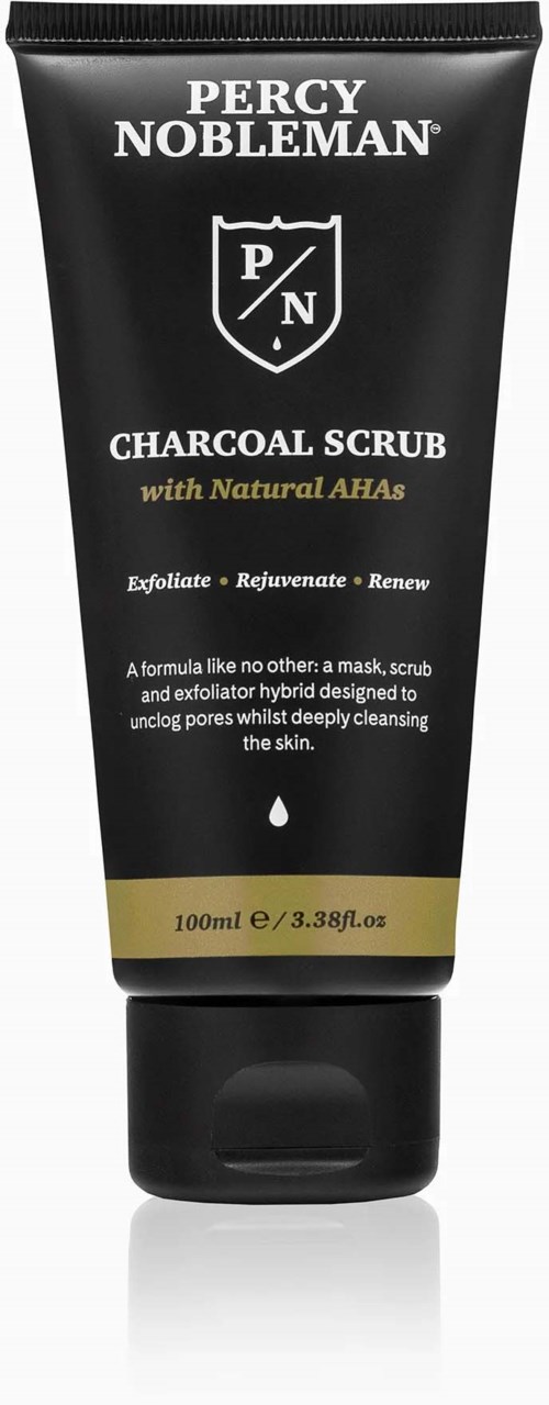 A black tube with a cap, featuring a Percy Nobleman logo, advertising a charcoal scrub for skin cleansing and renewal.