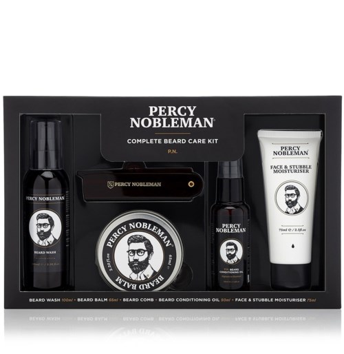 A grooming kit with beard wash, balm, comb, conditioner oil, and face moisturizer in a black box.