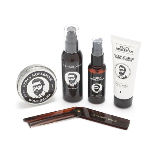 A collection of men's grooming products including a beard balm, beard wash, face moisturizer, and a comb.