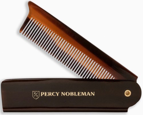 A black hair comb case with gold lettering says "Percy Nobleman". The comb is brown with white teeth.