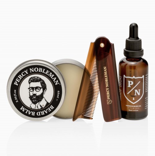 A set of grooming products, including beard balm, comb, oil, and eucalyptus jar, arranged neatly on a white background.