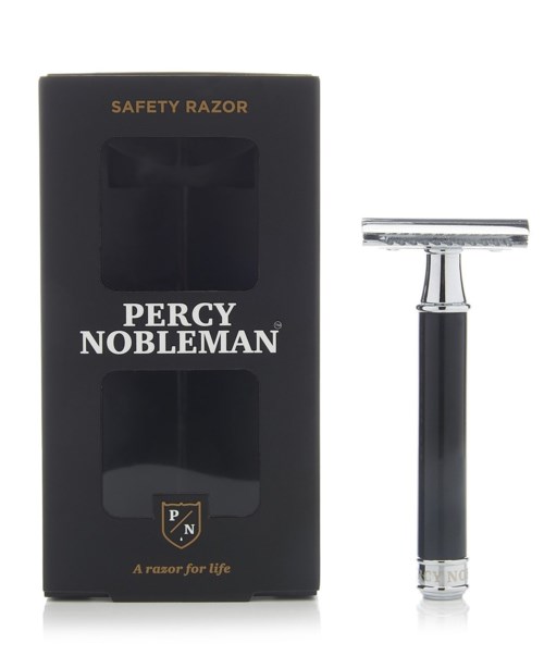 A safety razor in a black box with a transparent window, and the razor itself is silver and black.