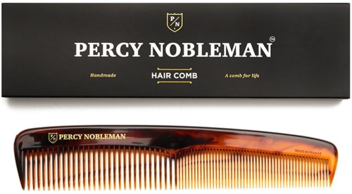 A Percy Nobleman hair comb with a black box and gold lettering, featuring a tortoiseshell-style handle.