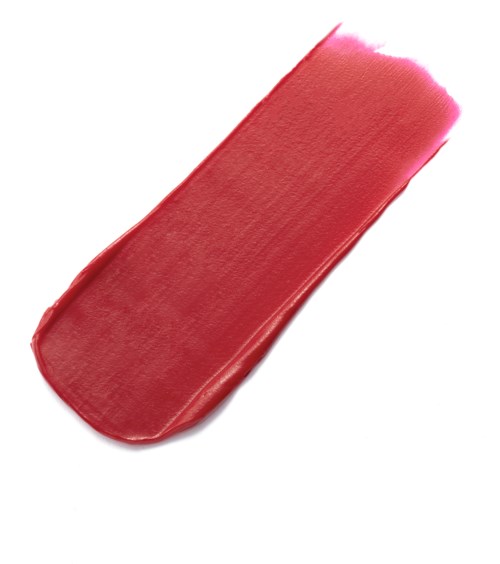 A smear of pink lipstick on a white background. The lipstick is smooth and shiny.