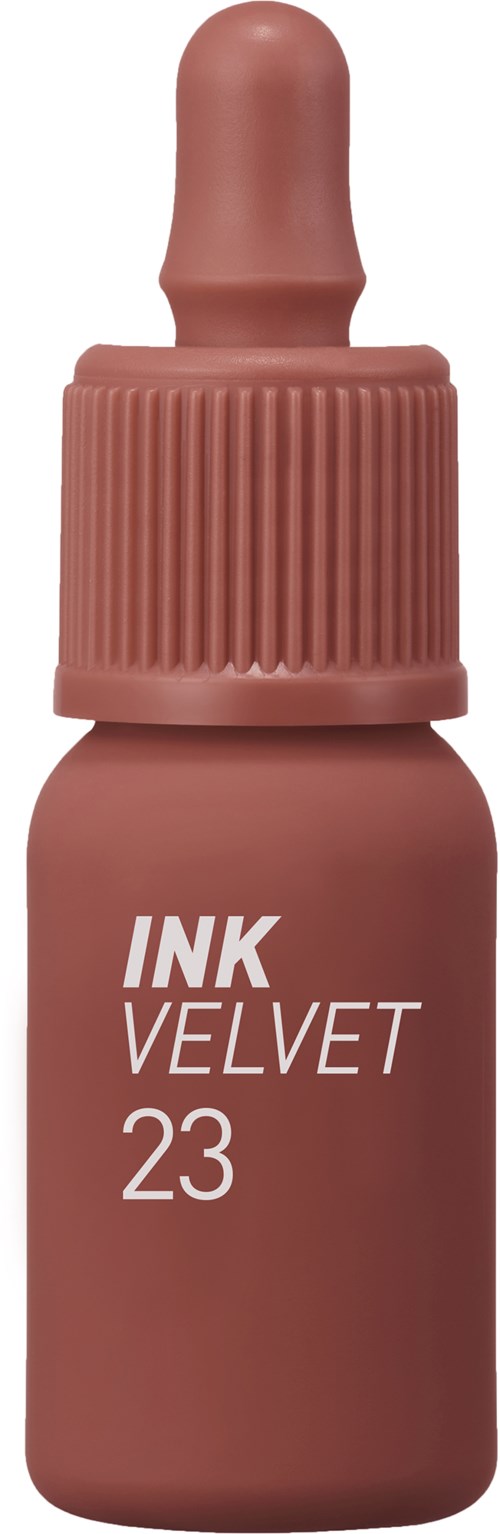 Een kleine roze fles met druppeldop, gemarkeerd "INK VELVET 23".