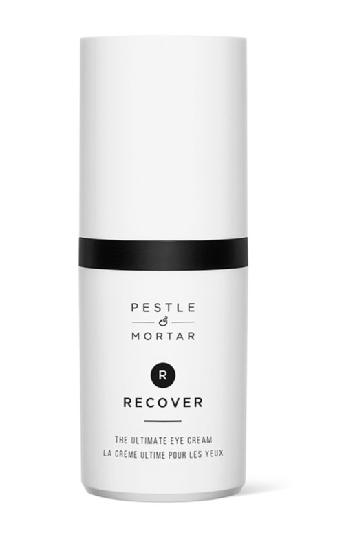 Weiße Flasche mit schwarzem Band, mit der Aufschrift 'Pestle & Mortar Recover Eye Cream'.