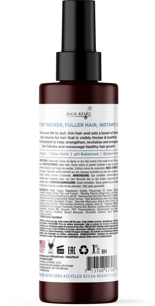 A bottle of Hair Rescue serum with a spray nozzle, dark color, and detailed label text.