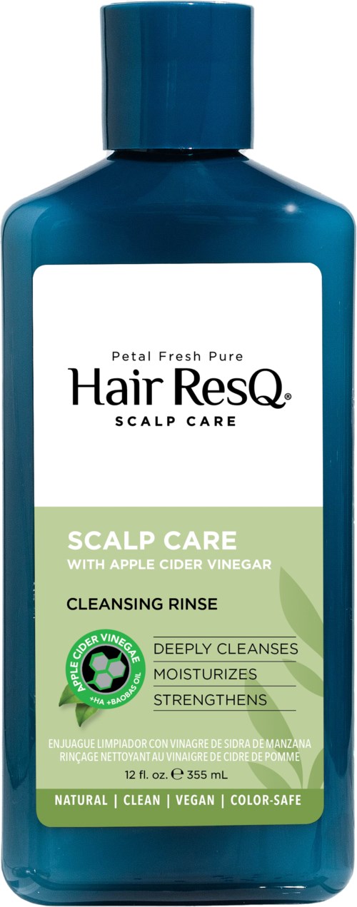 A blue bottle of hair care shampoo with a white and green label, featuring natural and vegan ingredients.