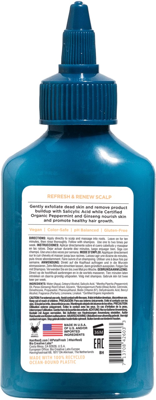 Blue scalp treatment bottle with a dropper cap, label describing its purpose and ingredients.