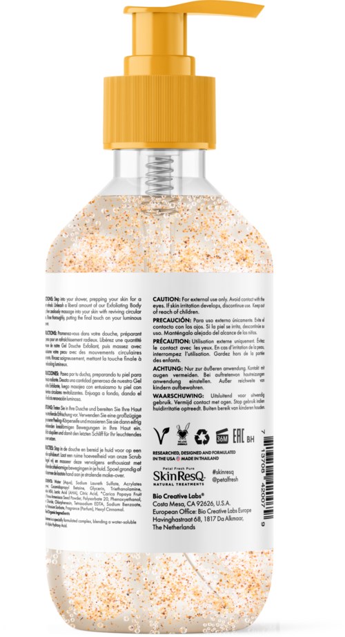 A clear bottle with a yellow pump contains exfoliating scrub with orange and white particles.