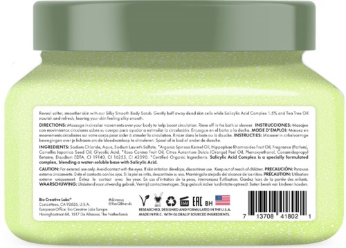 A green jar of skincare cream with instructions and ingredients listed on the label.