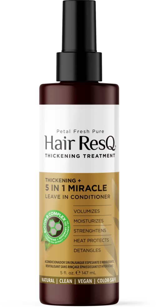 A dark brown hair conditioner bottle with a spray top, labels showing it is for thickening, moisturizing, and protecting hair.