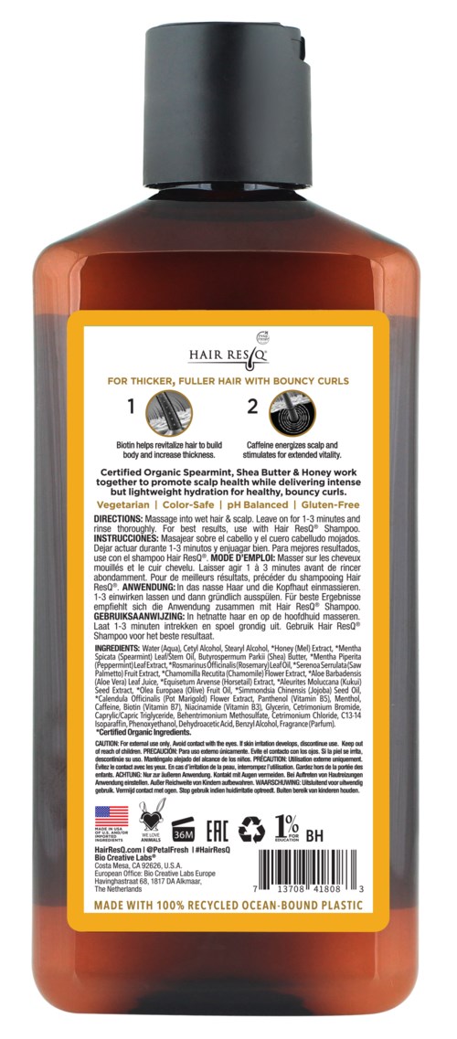 A brown bottle of hair care product with a yellow label and directions on the back.