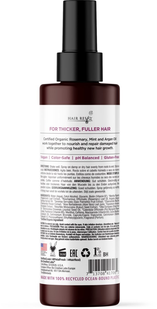 A dark bottle with a spray nozzle contains hair care product, labeled for fuller hair with natural ingredients.