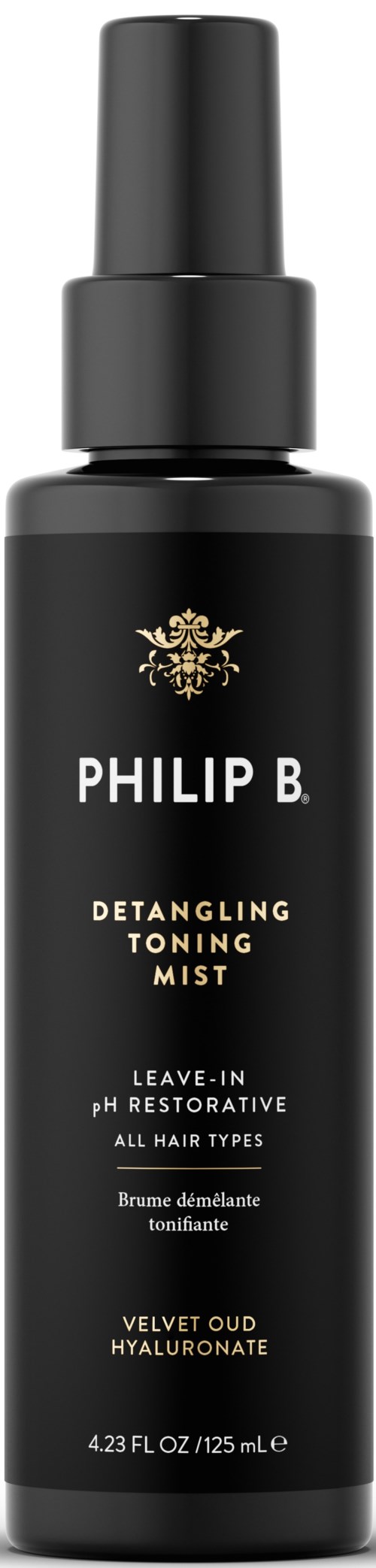 Czarna butelka z rozpylaczem oznaczona Philip B. Detangling Toning Mist, z złotym i białym tekstem oraz złotym emblematem na górze.