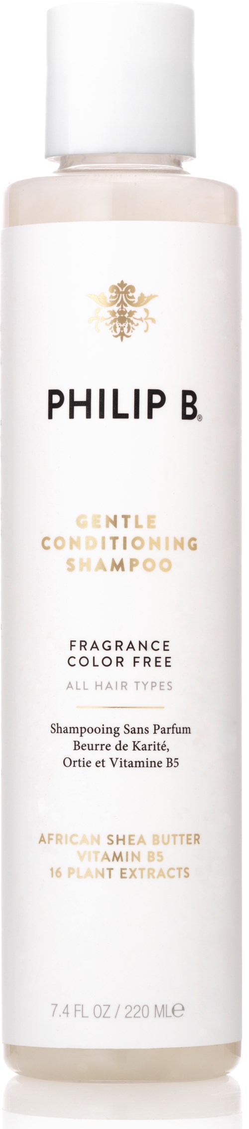 Długa butelka szamponu z białą nakrętką, oznaczona Philip B Gentle Conditioning Shampoo, bez zapachu, z masłem shea i ekstraktami roślinnymi.