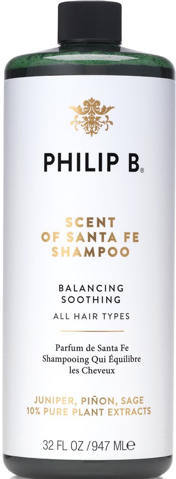 Eine Flasche Philip B. Scent of Santa Fe Shampoo mit weißem Etikett, schwarzem Deckel und gold- und schwarze Schrift.